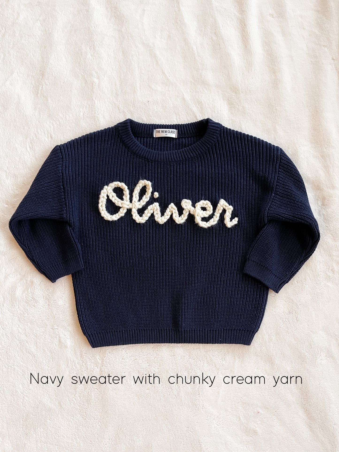 Navy sweater with chunky cream yarn